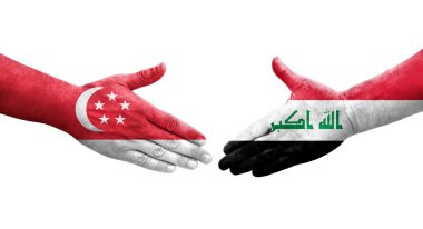 Irak ve Singapur bayrakları arasında el sıkışma, izole edilmiş şeffaf görüntü.
