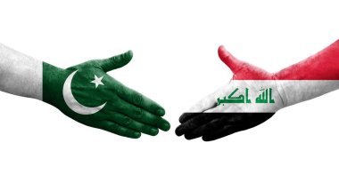 Irak ve Pakistan bayrakları arasında el sıkışma, izole şeffaf görüntü.
