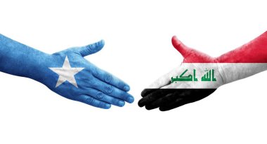 Irak ve Somali bayrakları arasındaki el sıkışma ellerinde resmedilmiş şeffaf görüntü.