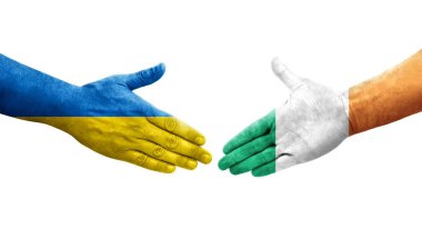 İrlanda ve Ukrayna bayrakları arasındaki el sıkışma, izole şeffaf görüntü.