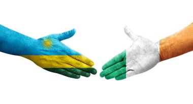 İrlanda ve Ruanda bayrakları arasında el sıkışma, izole şeffaf görüntü.