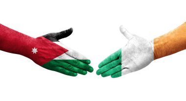 İrlanda ve Ürdün bayrakları arasındaki el sıkışma ellerinde resmedilmiş şeffaf bir görüntü.