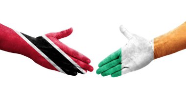 İrlanda ve Trinidad Tobago bayrakları arasındaki el sıkışma ellerinde izole şeffaf görüntü.