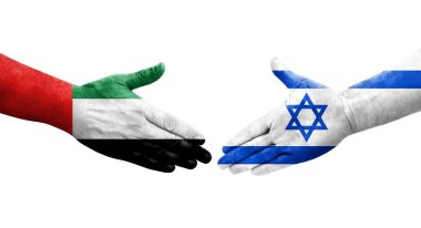 İsrail ve BAE bayrakları arasındaki el sıkışma, izole edilmiş şeffaf görüntü.