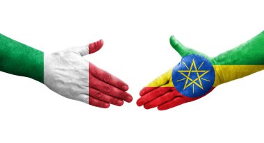 İtalya ve Etiyopya bayrakları arasındaki tokalaşma elleri boyalı, izole şeffaf görüntü.