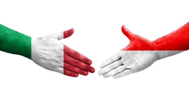 İtalya ve Endonezya bayrakları arasındaki el sıkışma ellerinde resmedilmiş şeffaf görüntü.