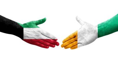 Fildişi Sahilleri ve Kuveyt bayrakları arasındaki el sıkışma, izole şeffaf görüntü.