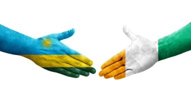 Fildişi Sahili ve Ruanda bayrakları arasındaki el sıkışma ellerinde izole şeffaf görüntü.