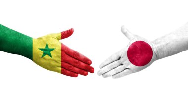 Japonya ve Senegal bayrakları arasındaki el sıkışma, izole şeffaf görüntü.