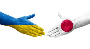 Japonya ve Ukrayna bayrakları arasındaki el sıkışma, izole şeffaf görüntü.