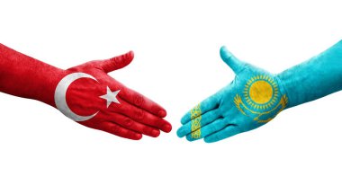 Kazakistan ve Türkiye bayrakları arasındaki el sıkışma, izole edilmiş şeffaf görüntü.