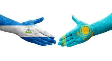 Kazakistan ve Nikaragua bayrakları arasındaki el sıkışma, izole şeffaf görüntü.