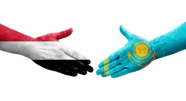 Kazakistan ve Yemen bayrakları arasındaki el sıkışma ellerinde resmedilmiş şeffaf görüntü.