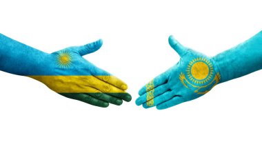 Kazakistan ve Ruanda bayrakları arasındaki el sıkışma ellerinde izole şeffaf görüntü.