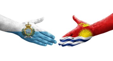Kiribati ve San Marino bayrakları arasındaki el sıkışma..