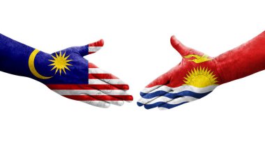 Ellerinde Kiribati ve Malezya bayrakları arasında el sıkışma, izole şeffaf görüntü.