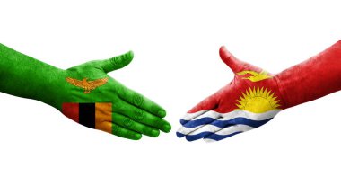 Ellerinde Kiribati ve Zambiya bayrakları arasında el sıkışma, izole şeffaf görüntü.