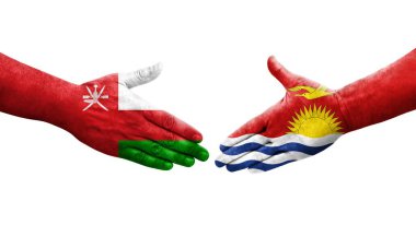 Ellerinde Kiribati ve Umman bayrakları arasında el sıkışma, izole şeffaf görüntü.