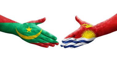 Ellerinde Kiribati ve Moritanya bayrakları arasında el sıkışma, izole şeffaf görüntü.
