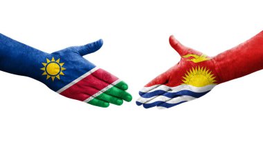 Ellerinde Kiribati ve Namibya bayrakları arasında el sıkışma, izole şeffaf görüntü.