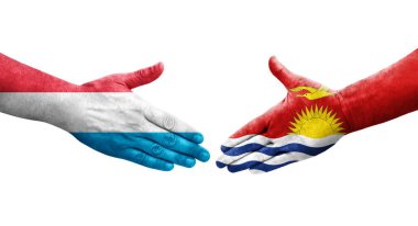 Kiribati ve Lüksemburg bayrakları arasındaki el sıkışma, izole şeffaf görüntü.