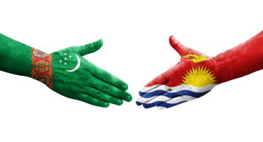 Ellerinde Kiribati ve Türkmenistan bayrakları arasında el sıkışma, izole şeffaf görüntü.