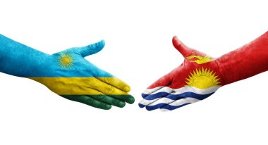 Kiribati ve Ruanda bayrakları arasındaki el sıkışma ellerinde izole şeffaf görüntü.