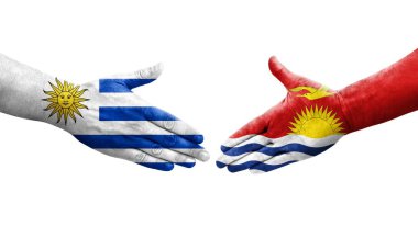 Ellerinde Kiribati ve Uruguay bayrakları arasında el sıkışma, izole şeffaf görüntü.