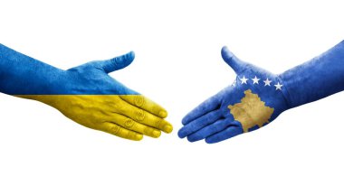 Kosova ile Ukrayna bayrakları arasındaki el sıkışma, izole edilmiş şeffaf görüntü.