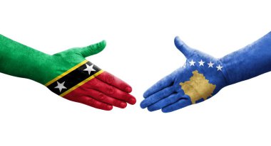Kosova ile Saint Kitts ve Nevis bayrakları arasındaki el sıkışma, izole şeffaf görüntü.