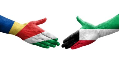 Kuveyt ve Seyşeller arasındaki el sıkışma ellerinde bayraklar, izole şeffaf görüntü.