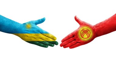 Kırgızistan ve Ruanda bayrakları arasındaki el sıkışma ellerinde izole şeffaf görüntü.