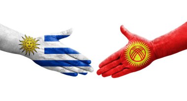 Kırgızistan ve Uruguay bayrakları arasındaki el sıkışma, izole şeffaf görüntü.