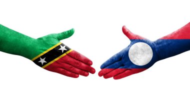 Laos ve Saint Kitts ve Nevis bayrakları arasındaki el sıkışma..