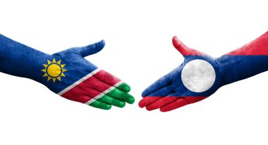 Laos ve Namibya bayrakları arasında el sıkışma, izole edilmiş şeffaf görüntü.