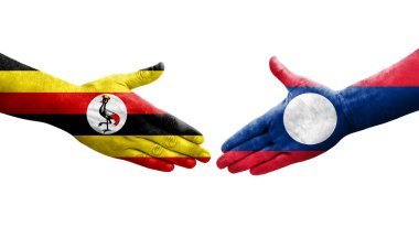 Ellerinde Laos ve Uganda bayrakları arasında el sıkışma, izole şeffaf görüntü.