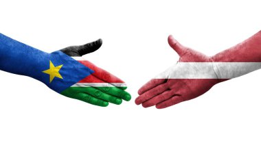 Letonya ve Güney Sudan bayrakları arasında el sıkışma, izole şeffaf görüntü.