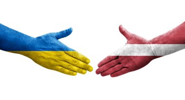 Ellerinde Letonya ve Ukrayna bayrakları arasında el sıkışma, izole şeffaf görüntü.