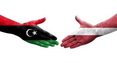 Ellerinde Letonya ve Libya bayrakları arasında el sıkışma, izole edilmiş şeffaf görüntü.