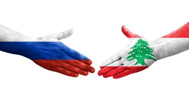 Lübnan ve Rusya arasındaki el sıkışma ellerinde bayraklar, izole edilmiş şeffaf görüntü.
