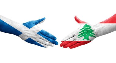 Lübnan ve İskoçya bayrakları arasındaki el sıkışma ellerinde resmedilmiş şeffaf bir görüntü.