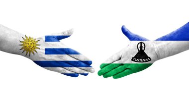 Lesotho ve Uruguay bayrakları arasındaki el sıkışma, izole şeffaf görüntü.