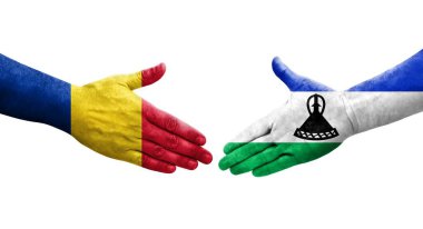 Lesotho ve Romanya bayrakları arasındaki el sıkışma, izole şeffaf görüntü.