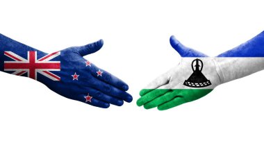 Lesotho ve Yeni Zelanda bayrakları arasında el sıkışma, izole şeffaf görüntü.