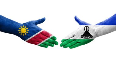 Lesotho ve Namibya bayrakları arasında el sıkışma, izole şeffaf görüntü.