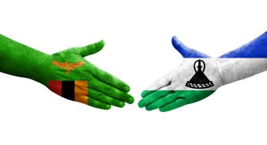 Lesotho ve Zambiya bayrakları arasında el sıkışma, izole şeffaf görüntü.