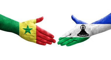 Lesotho ve Senegal bayrakları arasındaki el sıkışma, izole şeffaf görüntü.