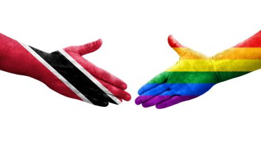 LGBT ve Trinidad Tobago bayrakları arasındaki tokalaşma elleri boyalı, izole şeffaf görüntü.