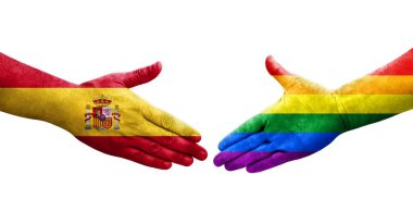 Ellere boyanmış LGBT ve İspanya bayrakları arasındaki el sıkışma, izole saydam resim.
