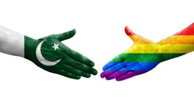 LGBT ve Pakistan bayrakları arasındaki el sıkışma, izole edilmiş şeffaf görüntü.